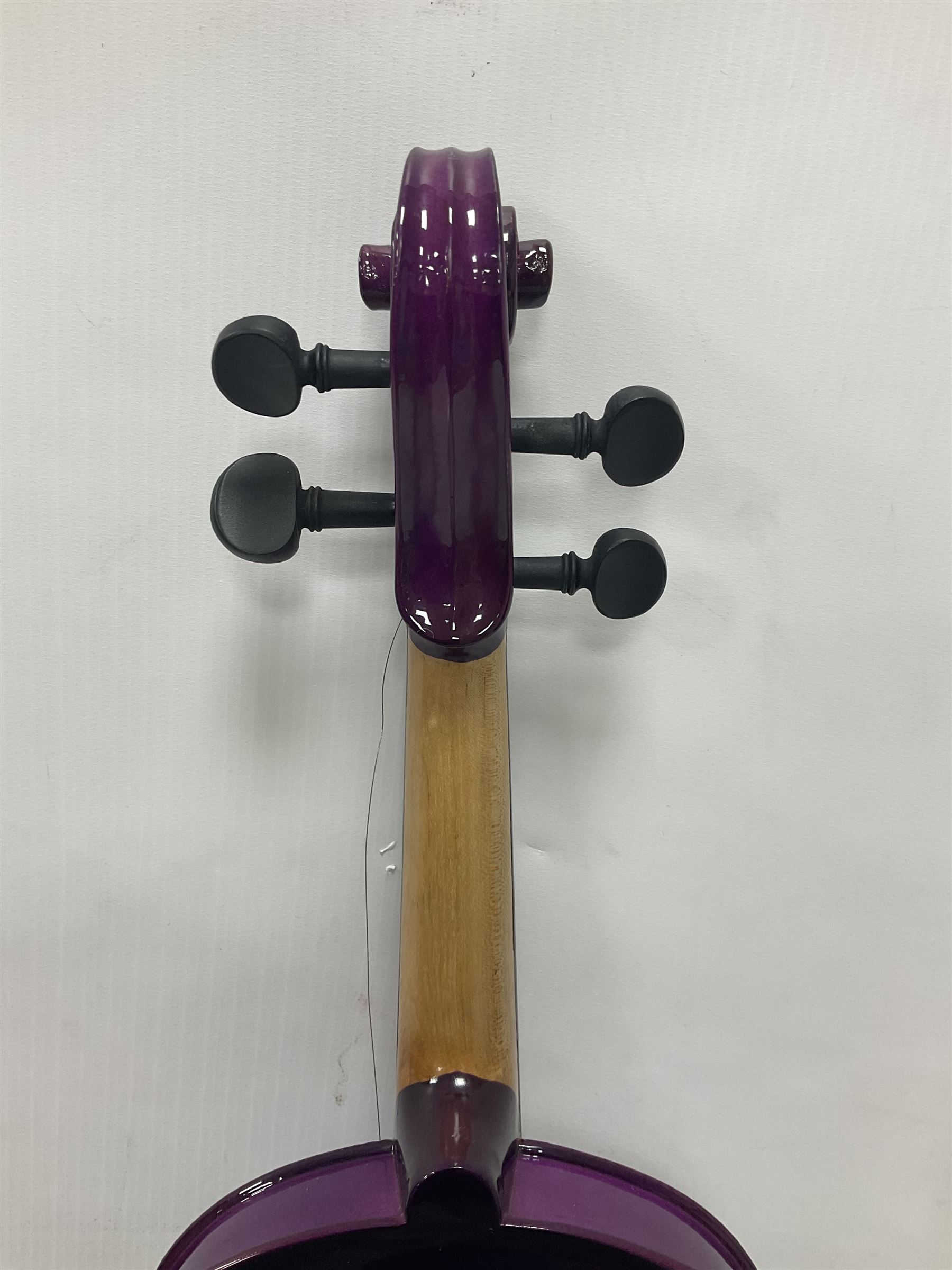 Intermusic 3/4 violin with a violet coloured solid wood body, ebonised fingerboard and fittings, bow and hard case, length 54cm