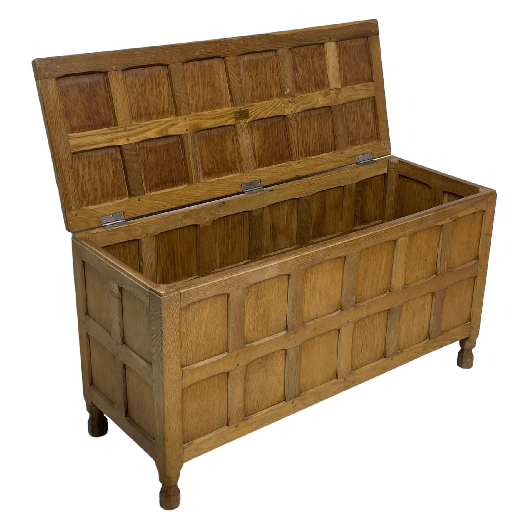 Sid Pollard (ex. Mouseman) - Yorkshire oak blanket chest, all over panelling, enclosed by hinged lid, on octagonal feet, interior plaque inscribed 'S. Pollard, Bagby, Thirsk, Yorks' 