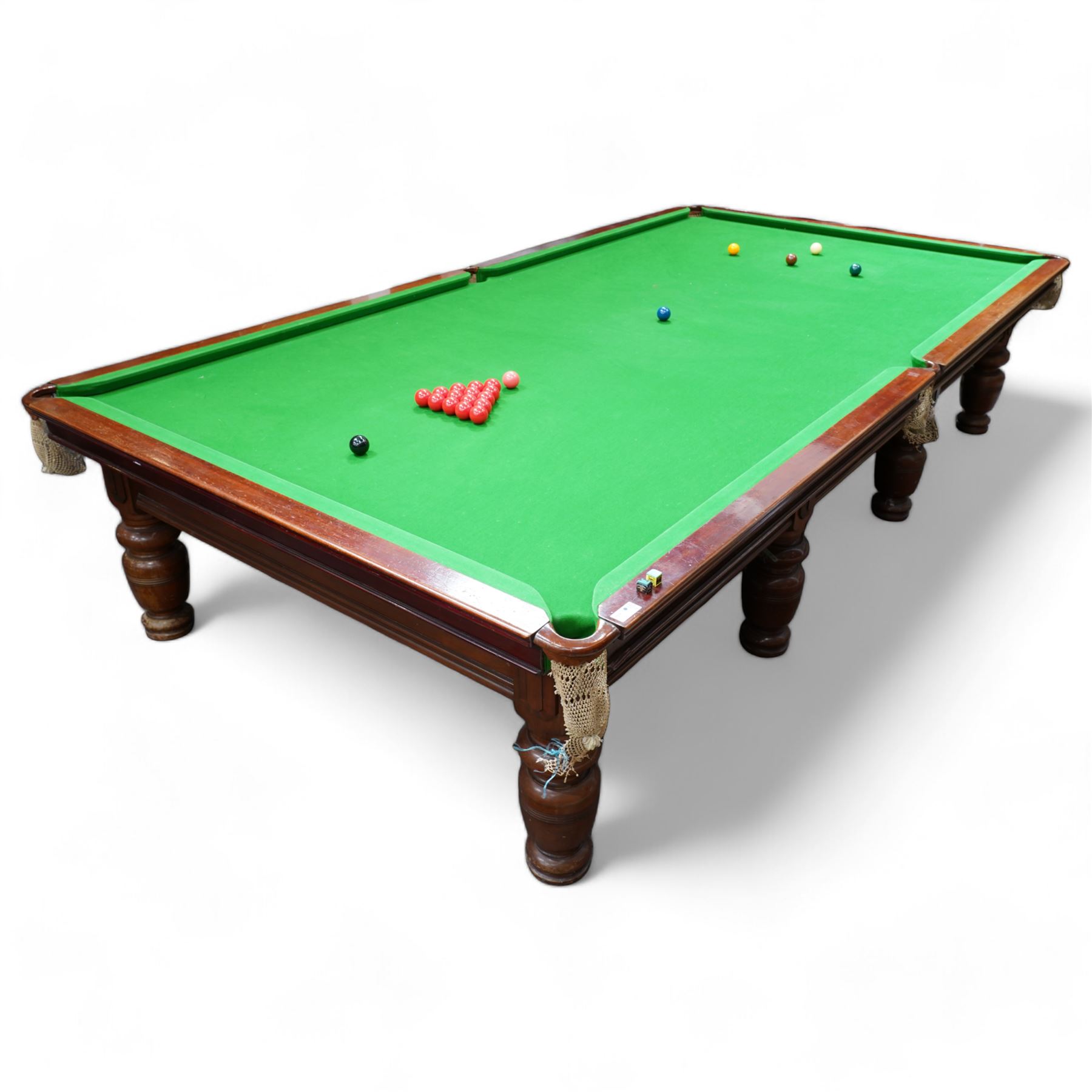 Riley - early 20th century full-sized mahogany billiards or snooker table, on eight turned baluster supports, with cue rack, scoreboard, balls and various cues 