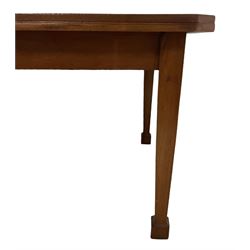 Mid-to-late 20th century teak dining table, rectangular top with canted corners, on square tapering supports with spade feet (214cm x 119cm, H76cm); and a set of eight Burmese reclaimed teak dining chairs, high arched back over panelled seat