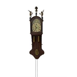 20th century weight driven Dutch WUBA wall clock -  with a break arch top and mounted gilt figures to the arch, painted dial with working moon disc, chapter ring with Roman numerals and pierced steel hands, twin train chain driven movement striking the hours on a bell. With pendulum and brass cased weights.