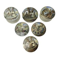 Six 19th century Prattware pot lids comprising 'The Village Wakes', three 'Bear on Rock', 'Shooting Bears' and 'Bear, Lion and Cock', two with associated bases, largest D9cm (6)