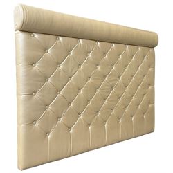 Large padded headboard, upholstered in beige buttoned faux leather