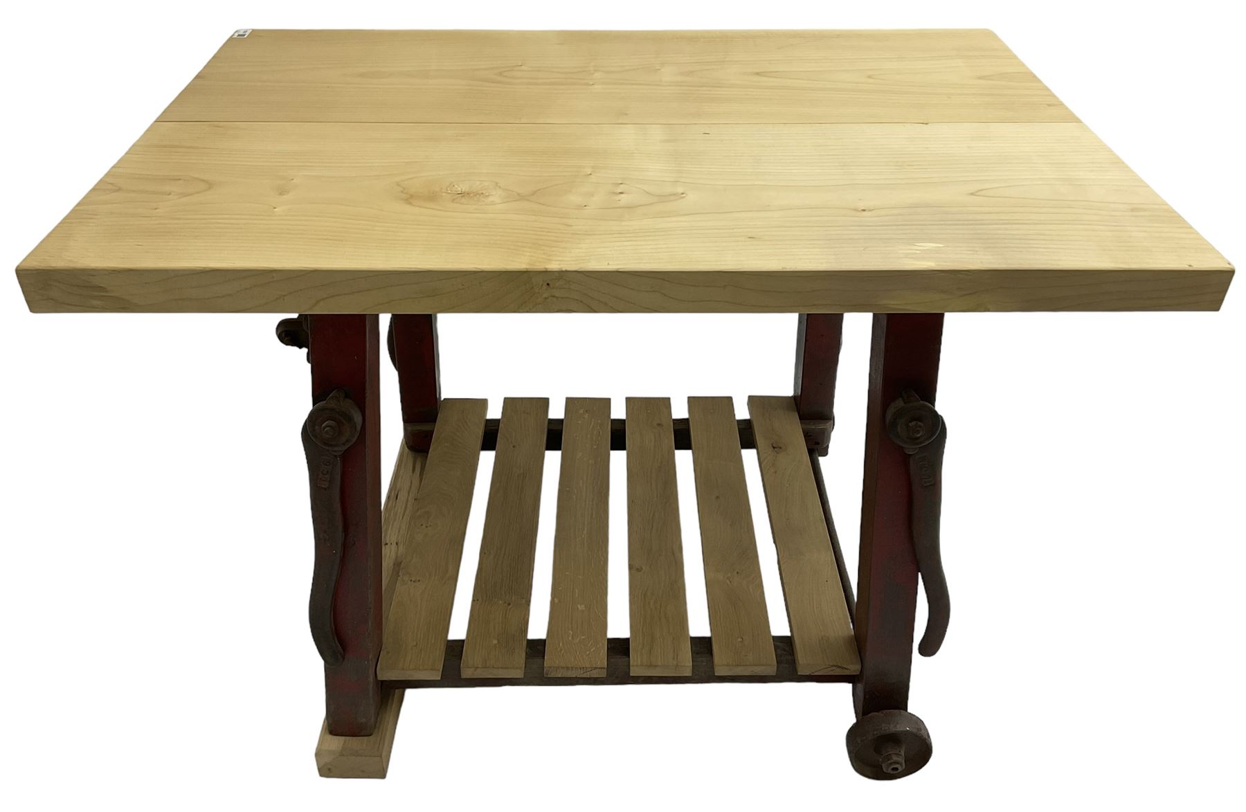 Kitchen island with rectangular maple top, on reclaimed machinery base with oak pot board, on block sledge feet