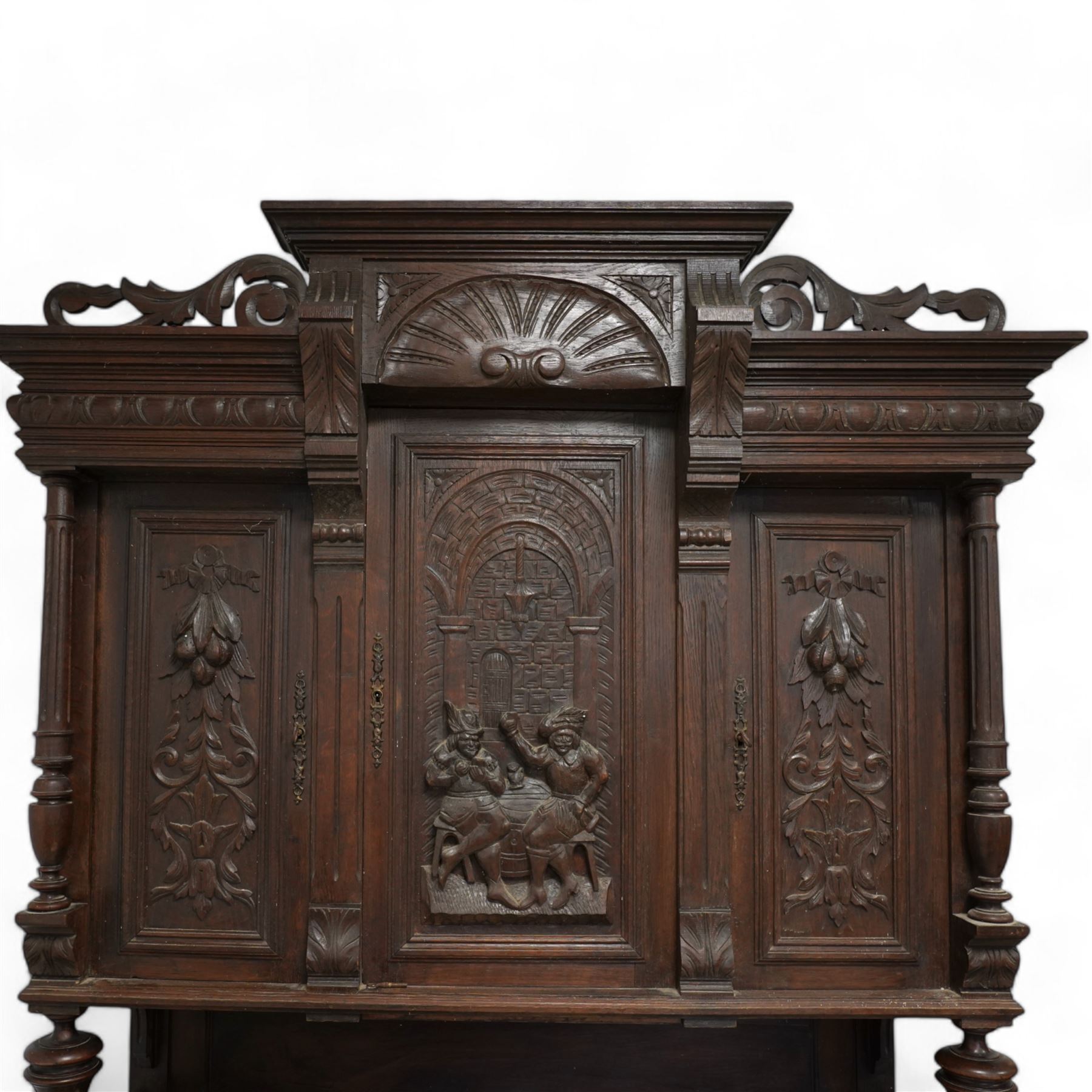 19th century Belgian buffet side cabinet, carved inn scene with figures, fitted with three cupboards, two drawers and two base cupboards