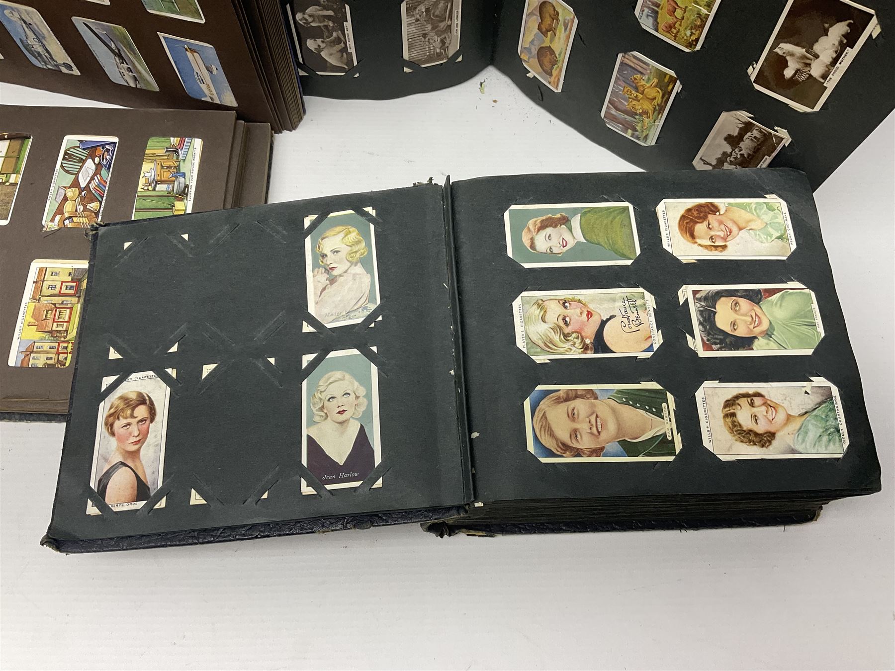 Four albums of cigarette cards, including Will's and Player's examples