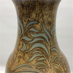 John Egerton (c1945-): studio pottery stoneware vase decorated with cranes in a riverscape upon a mottled brown ground, signed beneath H60cm