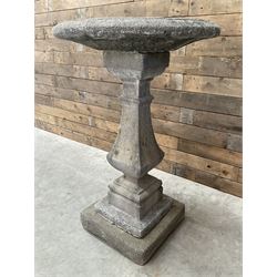 Cast stone garden bird bath, circular dished top, raised on square tapering column, on stepped base with separate mounting plinth