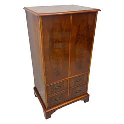 Wade - yew wood hi-fi cabinet, moulded rectangular hinged top over double-door cupboard with figured veneer, enclosing three adjustable shelves, lower section fitted with two cupboards to resemble four drawers, enclosing three drawers and open storage