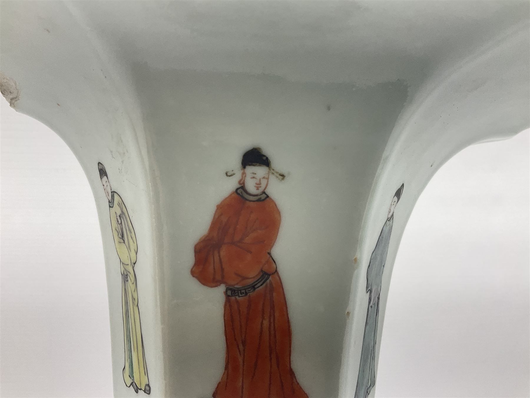 Chinese Kangxi gu vase, of hexagonal form with fluted rim, decorated in polychrome enamels with a male figure to each panel and red character marks to centre, with painted red leaf mark beneath, H32.5cm