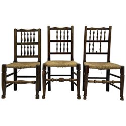 Collection of chairs - five 19th century elm spindle back chairs with rush seats; two chapel chairs (7)