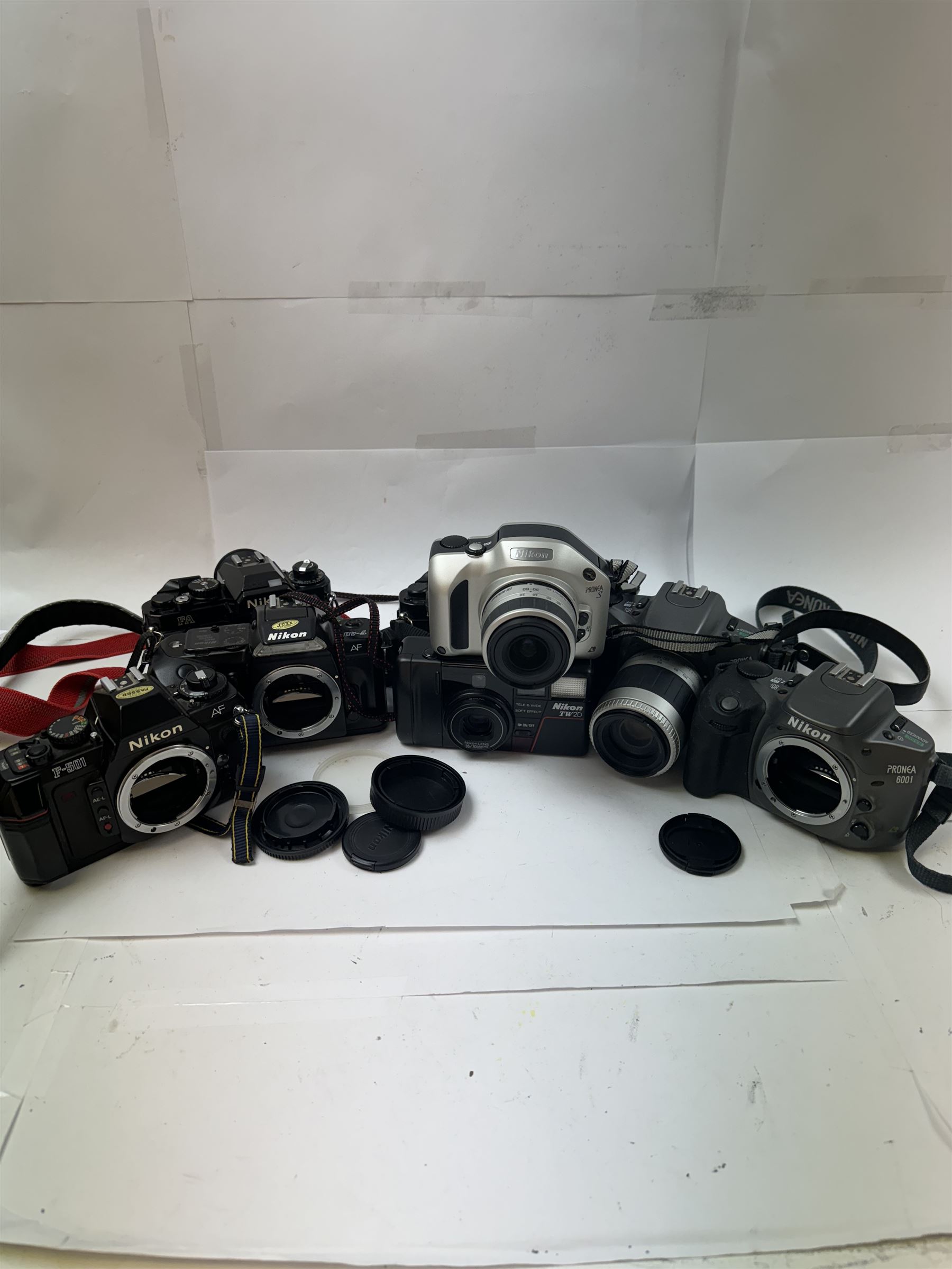 Collection of Nikon cameras, to include two Pronea 600i examples serial nos. 2040608 & 2043525, one with a IX-Nikkor 1:4.5-5.6 lens serial no. 2032529, Pronea S serial no. 2116530, with a IX-Nikkor 1:4-5.6 lens serial no. 2113968, a TW2D serial no. 6069039, F-401, F-501 and two FA camera bodies 