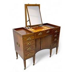 Late 19th century mahogany and satinwood dressing chest, the raised middle section hinges to reveal an interior fitted with lidded compartments, removable tray, single drawer and glass scent bottles, lift-up bevelled mirror with adjustable hinged mechanism, fitted with a further eight cock-beaded graduating drawers and curved kneehole with double cupboard, square tapering supports on brass cups and castors, inlaid throughout with checkered stringing, ornate Rococo cast gilt metal handles