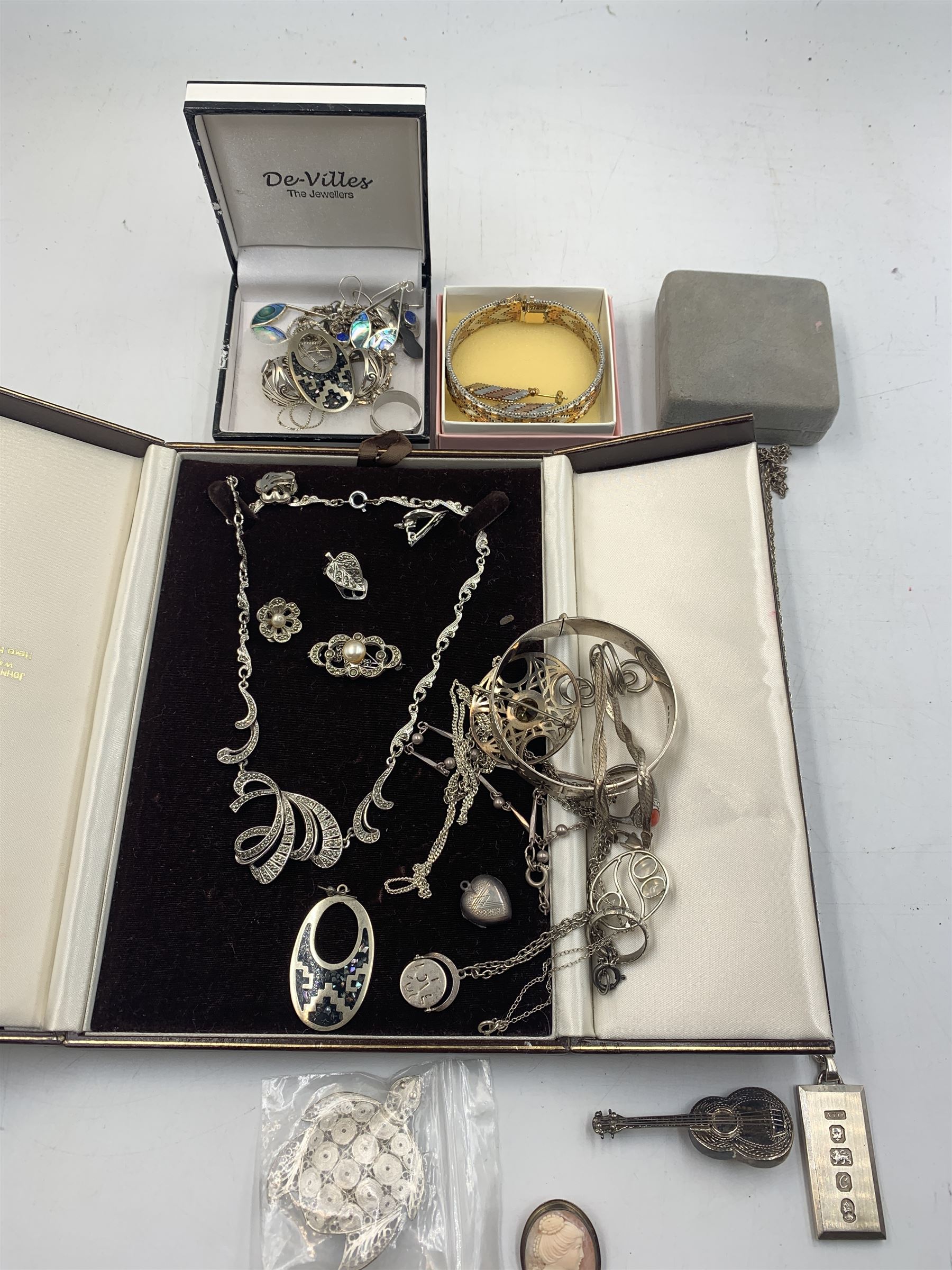 Silver jewellery, including an amber set necklace, pair of earrings and pin, silver charm bracelet, silver ingot pendant, filigree jewellery and other silver jewellery