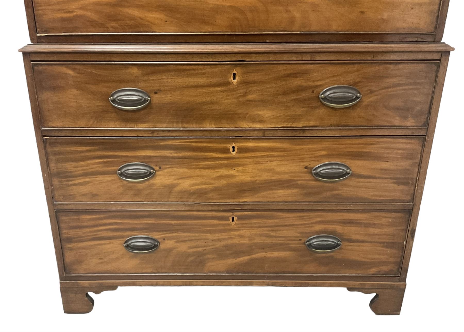 Early 19th century mahogany chest-on-chest, projecting cornice over banded frieze, fitted with two short over six long graduating cock-beaded drawers with bone and timber escutcheons, on bracket feet