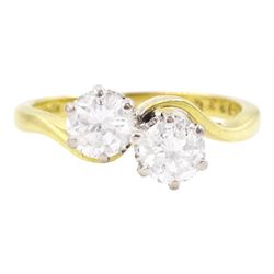 18ct gold two stone round brilliant cut diamond crossover ring, London 1975, total diamond...