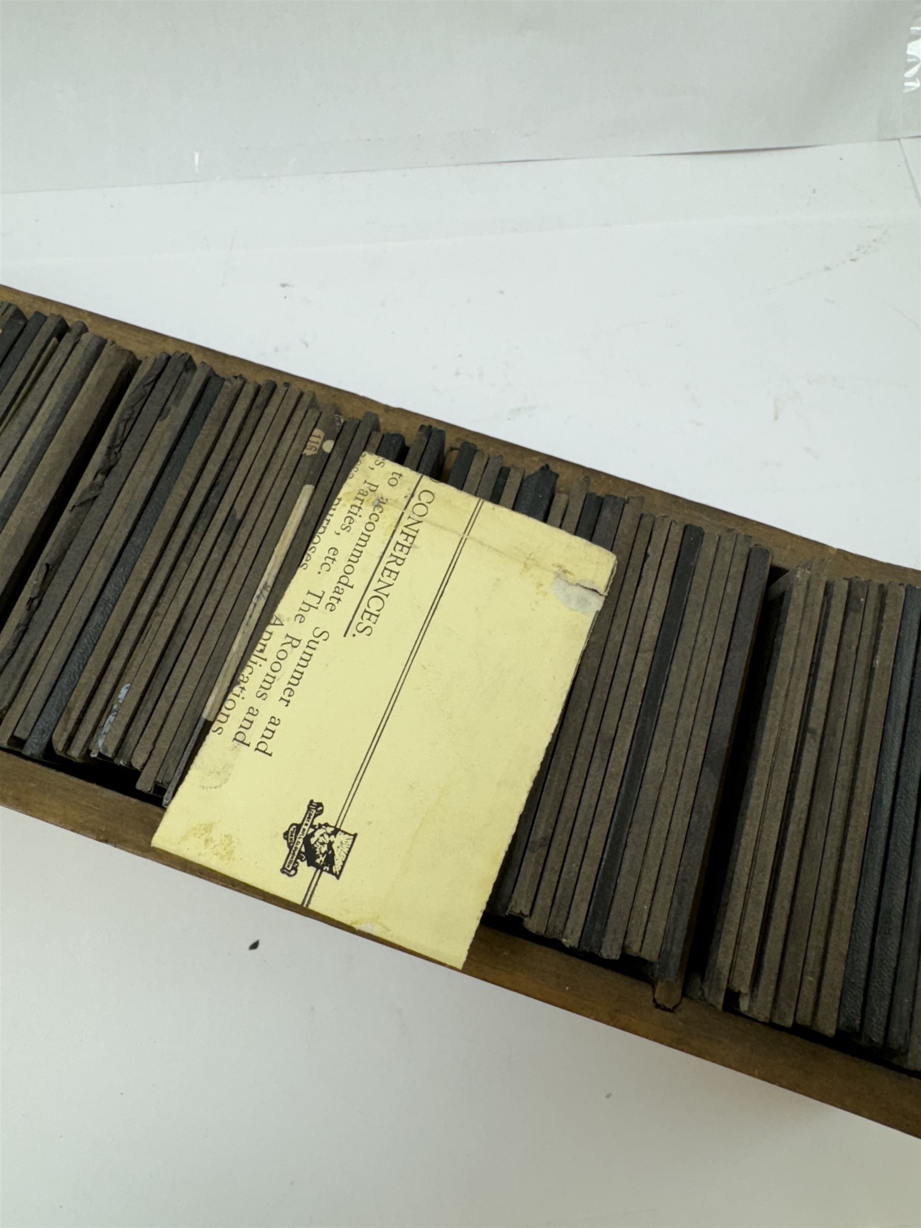 Collection of magic lantern slides, predominantly depicting views of India, with scenes including including the Taj Mahal, tombs, monuments, street scenes, people and animals, in compartmentalised wooden case 