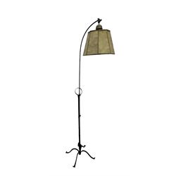 Early 20th century wrought iron standard lamp, the arched arm with adjustable height suppo...