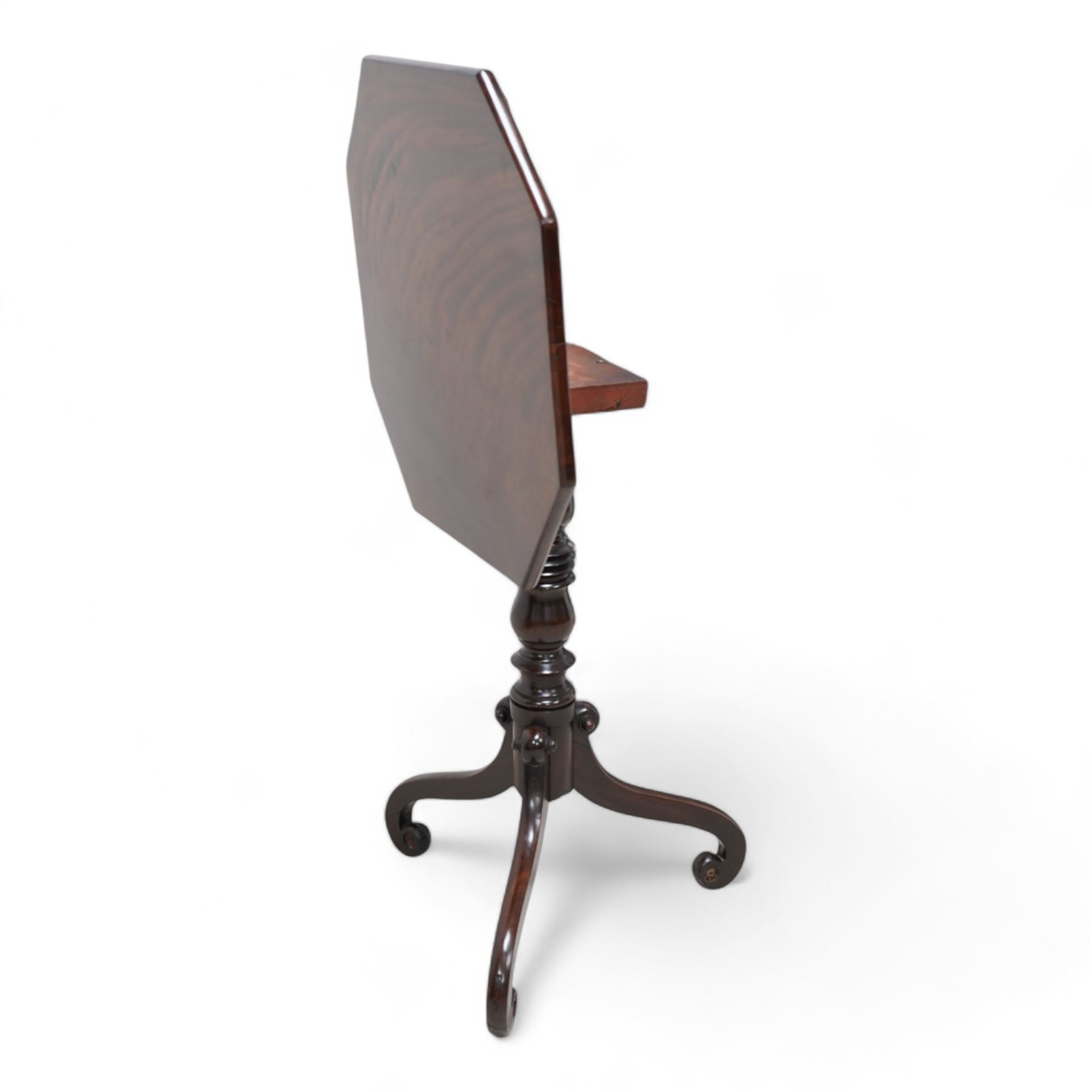 Regency mahogany tripod table, canted square tilt-top on turned column, three out splayed supports with scrolled terminals 