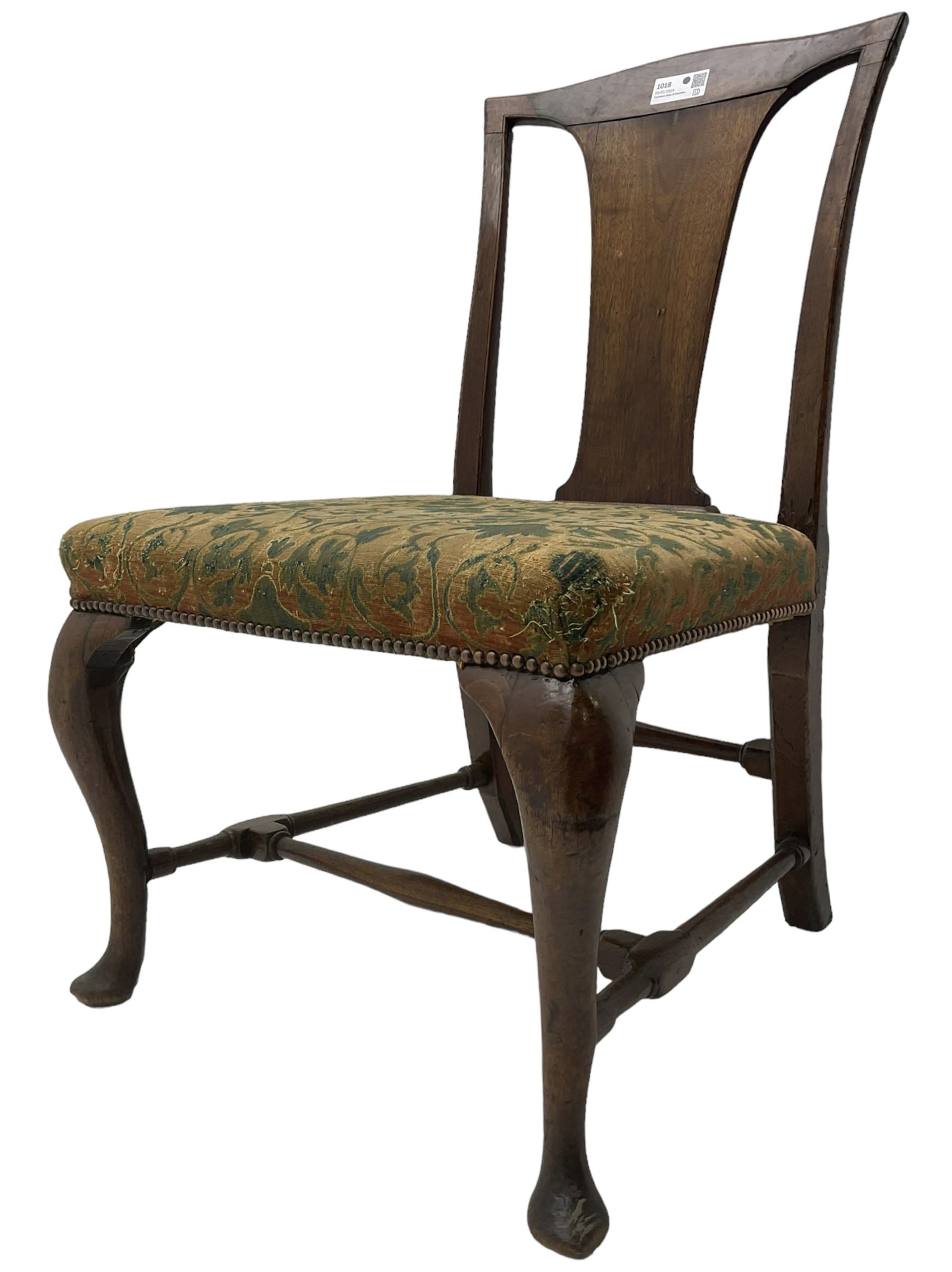 Mid-18th century mahogany side chair, shaped cresting rail over tapered back splat, seat upholstered in green and camel foliate patterned fabric with stud work border, raised on cabriole supports united by swell-turned stretchers