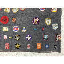 Boy Scout Interest; Scout blanket with collection of Boy Scouts cloth insignias and similar, to include badges from Lealholm North Yorkshire, Cleveland Country, South Shields etc, approximately 115 badges  