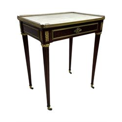 Late 19th century French figured plum pudding mahogany side table, canted rectangular white marble top with raised gilt metal gallery, fitted with a single frieze drawer, central extending floral cast ormolu escutcheon and applied moulded edging, on tapering turned and fluted supports with brass cups and castors, decorated with cast foliate mounts and foliate cast collars 