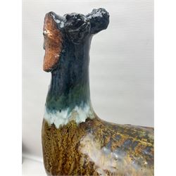 Large stoneware sculpture modeled as a Ring Neck Pheasant, upon a naturalistic base, H55cm, L78cm