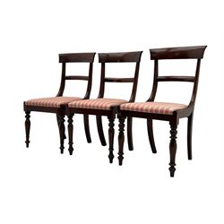 Set of six Victorian mahogany dining chairs, curved bar back over drop-in seat upholstered in striped fabric, on turned front supports