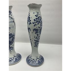 Pair of Delft blue and white vases, of elongated baluster form with shaped fluted rim, one depicting a Dutch sailing scene, the other a Dutch windmill scene, with painted mark beneath, H35.5cm