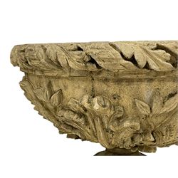 Pair of composite stone garden urn planters, acanthus leaf garland rim over foliate decorated body, stepped foot on square base