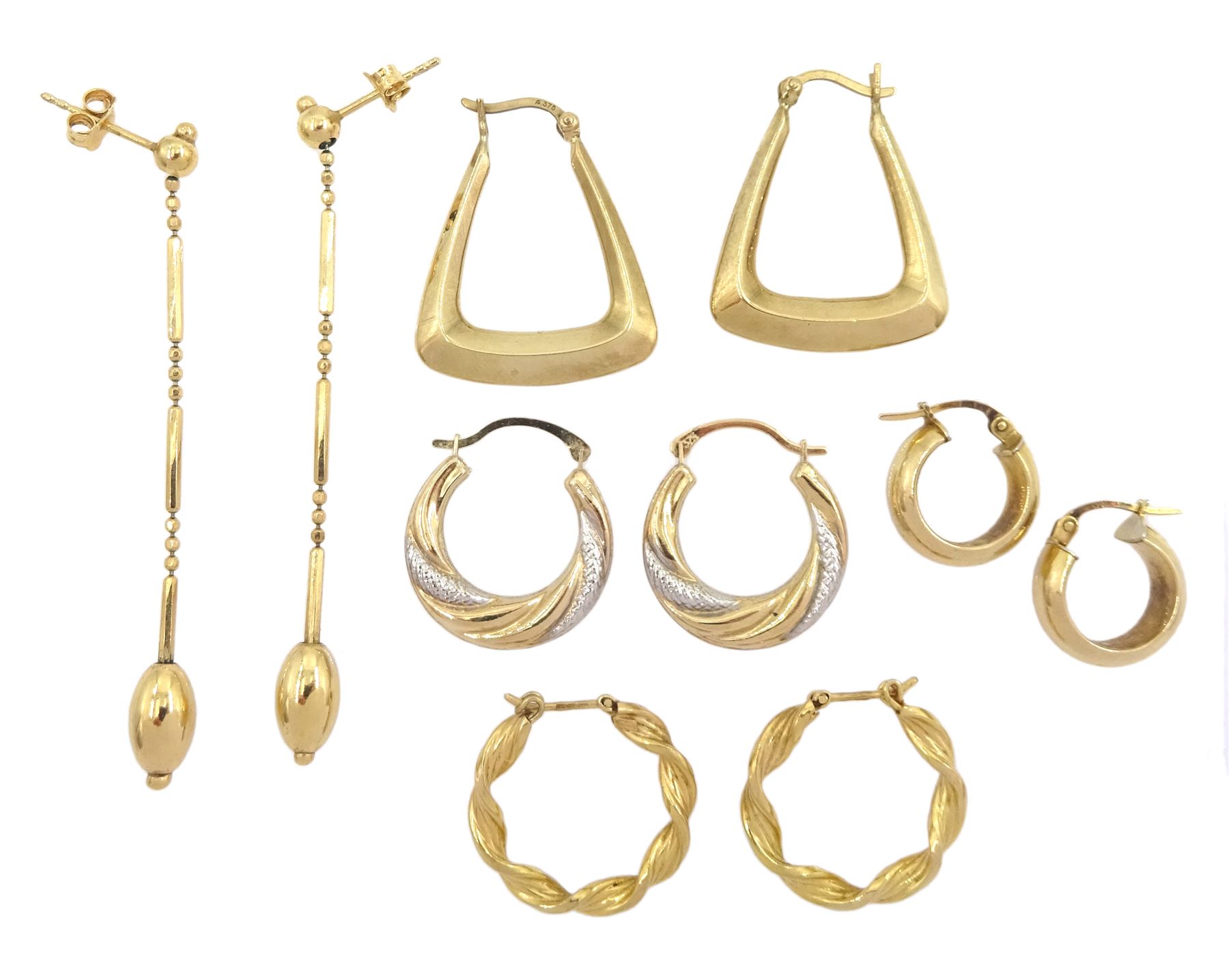 Four pairs of gold hoop earrings and a pair of gold pendant stud earrings, all 9ct