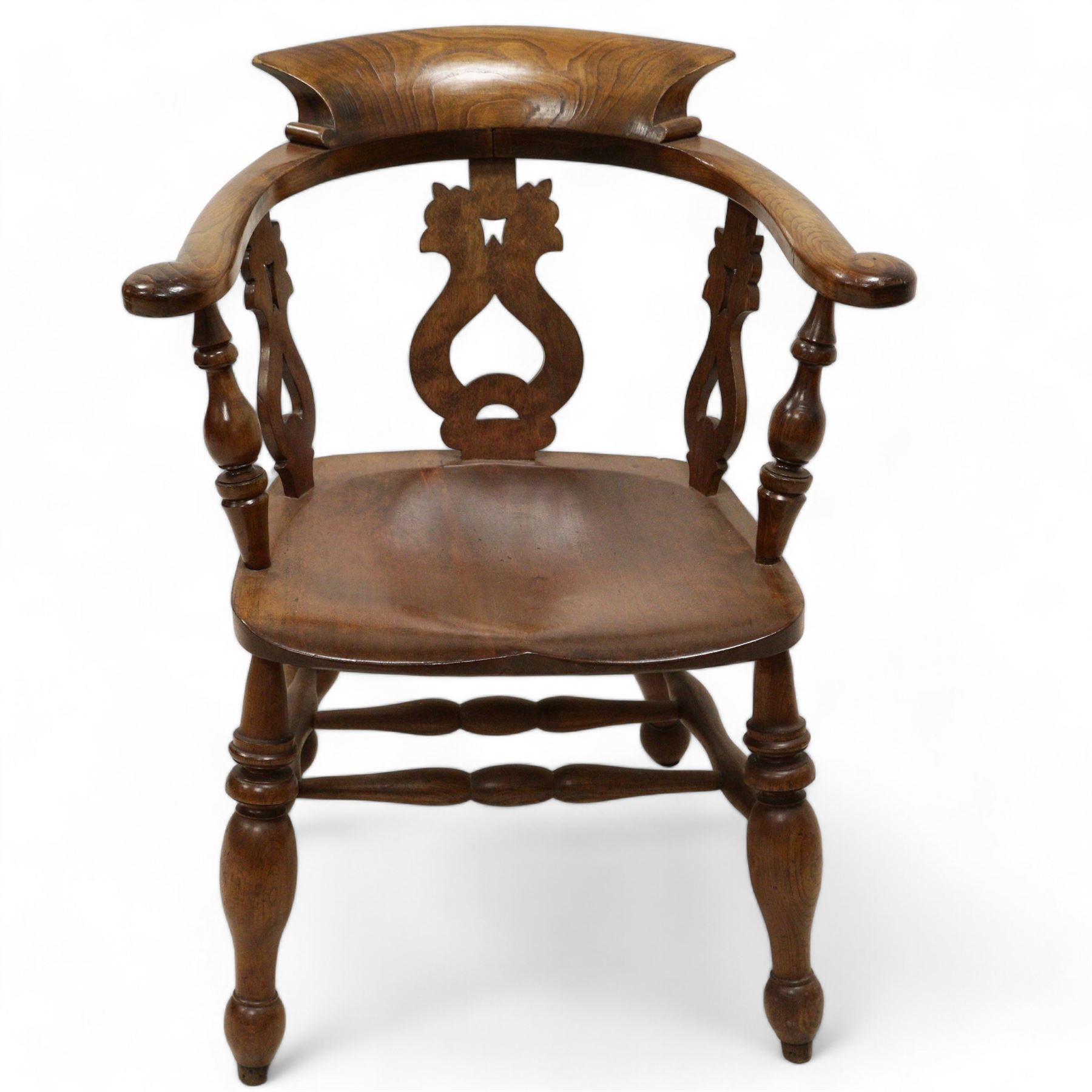 19th century elm and beech smokers bow Captains armchair, shaped and pierced splat, saddle seat, double H stretcher