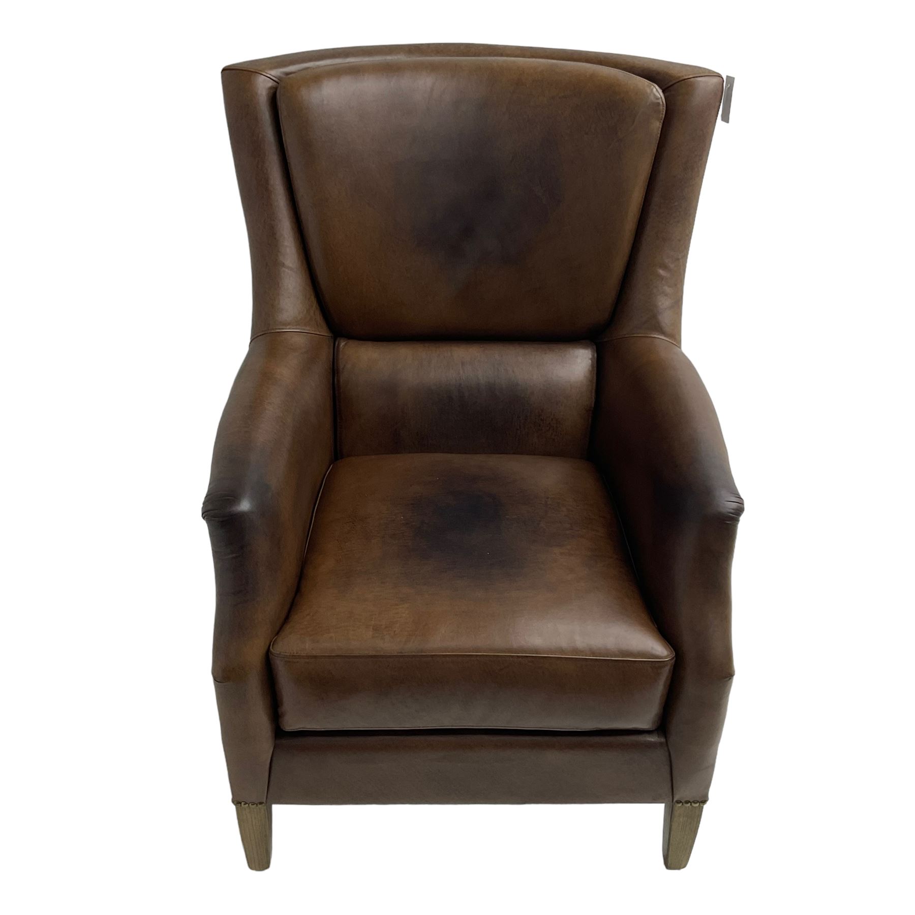 Club reading armchair, upholstered in brown Brazilian leather, studded detail, oak tapering legs