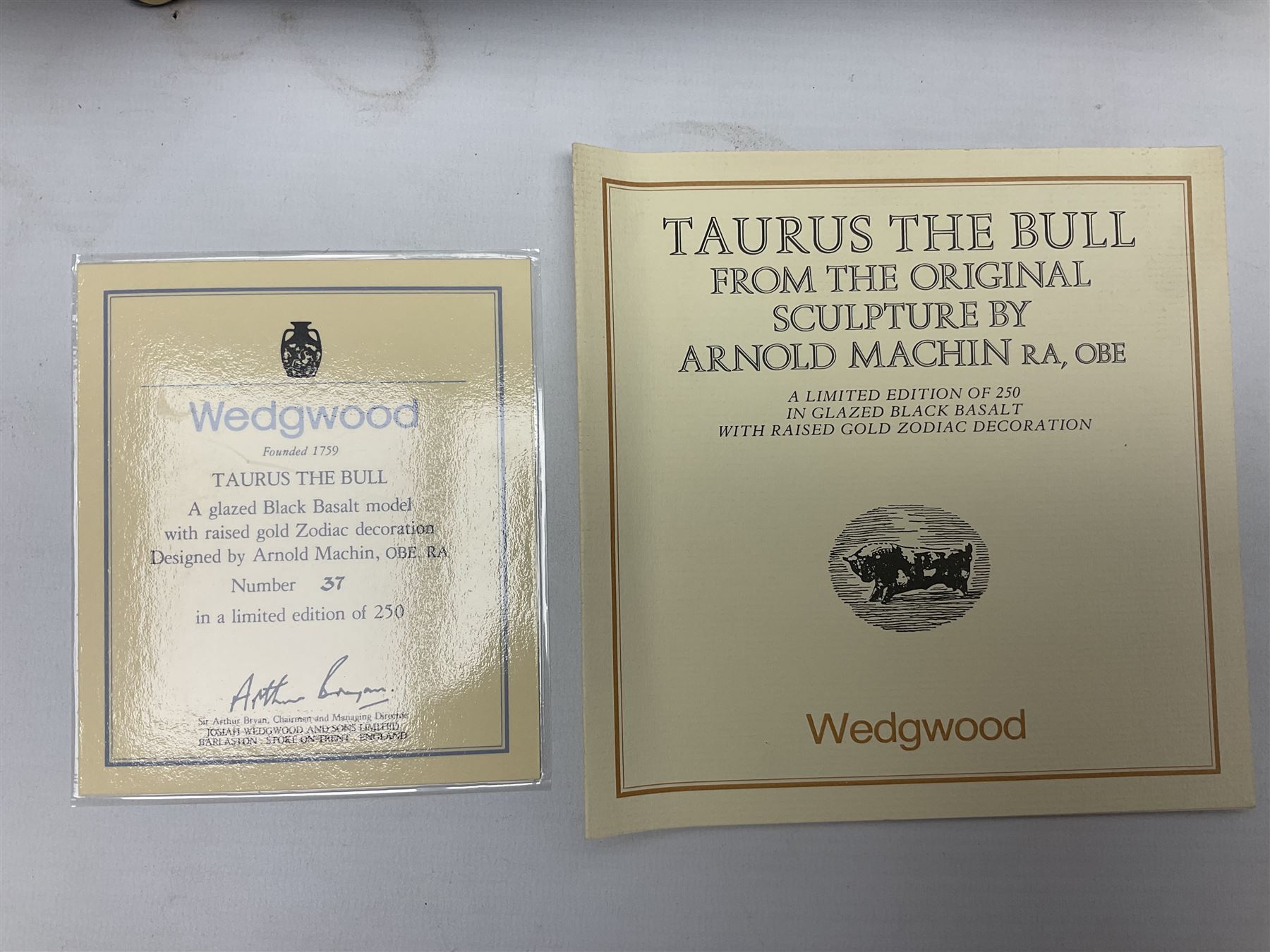 20th century Wedgwood Taurus the Bull, designed by Arnold Machin, and decorated with gilt signs of the zodiac upon a black ground, with certificate and original box, L40cm