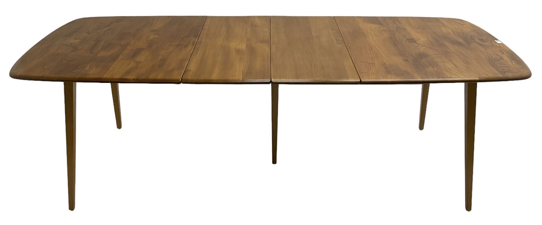 Ercol - light elm and beech 'Slide Leg Expanding Dining Table (444)', rectangular top with rounded corners, raised on tapered splayed supports, with two additional leaves