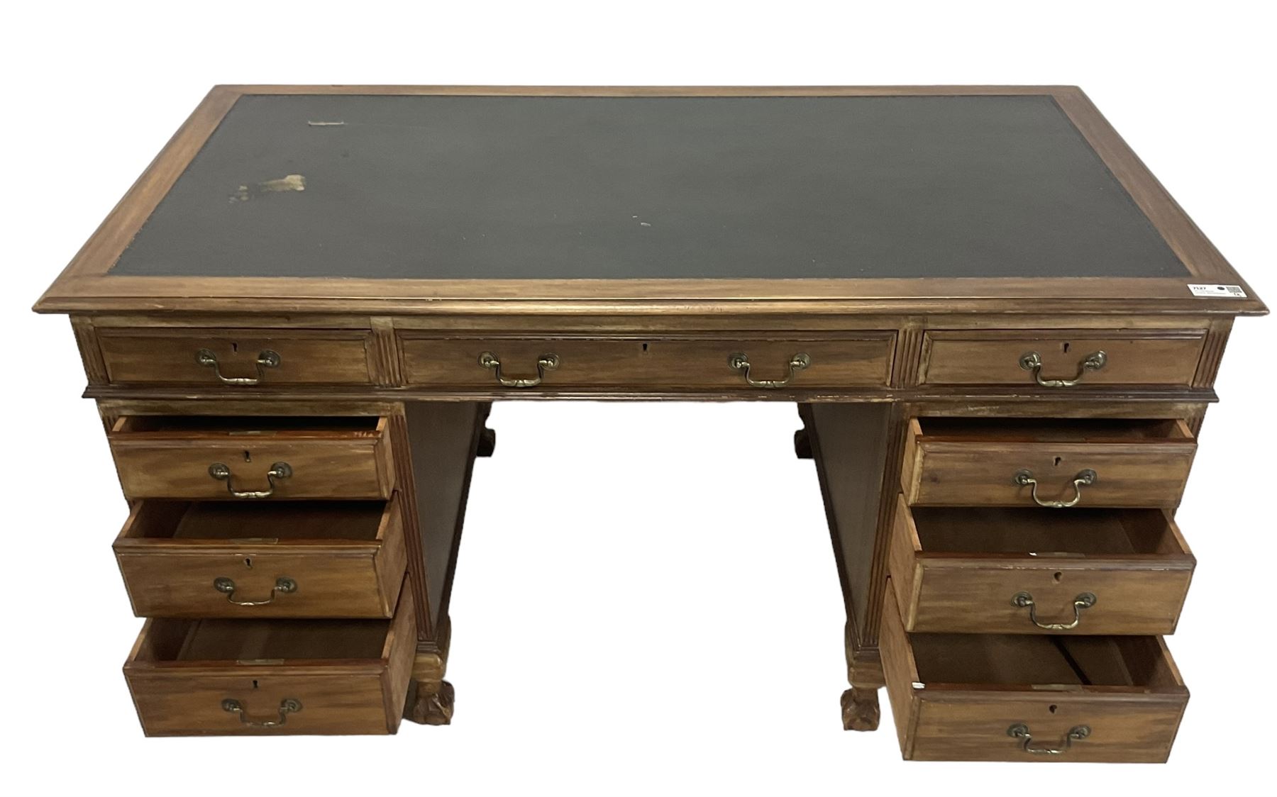 Georgian design twin pedestal desk, rectangular top with green leather inset, fitted with nine drawers, on cabriole supports with ball and claw feet 