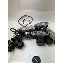 Five SLR cameras, to include Rolleiflex SL35, with a Rollei-HFT Planar 1.8/50 lens serial no. 1246774, Topcon Uni serial no. 5417650, with a Topcor Kogaku UV 1:2 f=53mm lens serial no. 5413035, Bell & Howell Auto35/Reflex Design 237, with a Canon EX 50mm 1:1.8 lens serial no. 92960, Petri GX-1 serial no. 91206945, with a Petri 50mm 1:2.0 lens serial no. 91107428, and a Konica Auto 52 serial no. 1193641, with a Konica Hexanon 1:1.8 f=45mm lens, all in cases 