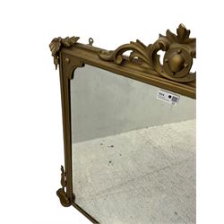 19th century gilt framed overmantel mirror, cartouche pediment surrounded by curling leaves, moulded framed enclosing plain mirror plate, decorated with applied trailing foliage motifs 