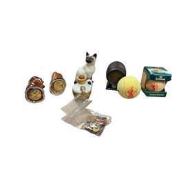 Six whisky miniatures in novelty decanters, together with Beswick cat, and nine Robertsons Golly badges