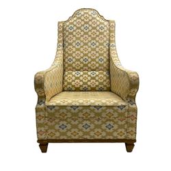 Spanish high back throne armchair, arched cresting rail over scooped arms, upholstered in gold and ivory patterned fabric, on a pitch pine base with spade feet