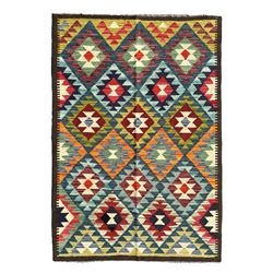 Maximana Kilim ground rug, the field decorated with a geometric pattern of multi-coloured diamonds and triangles, each containing stylised motifs, enclosed by a plain brown border