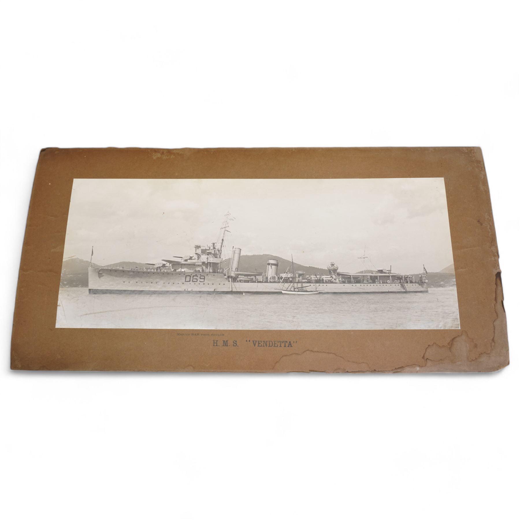 Pair of photographs of H.M.S. Vendetta and H.M.S. Voyager by Marius Bar, Toulon 23cm x 57cm, various military photographs and a number of A.R.P. and  Civil Defence badges 1939-45, framed