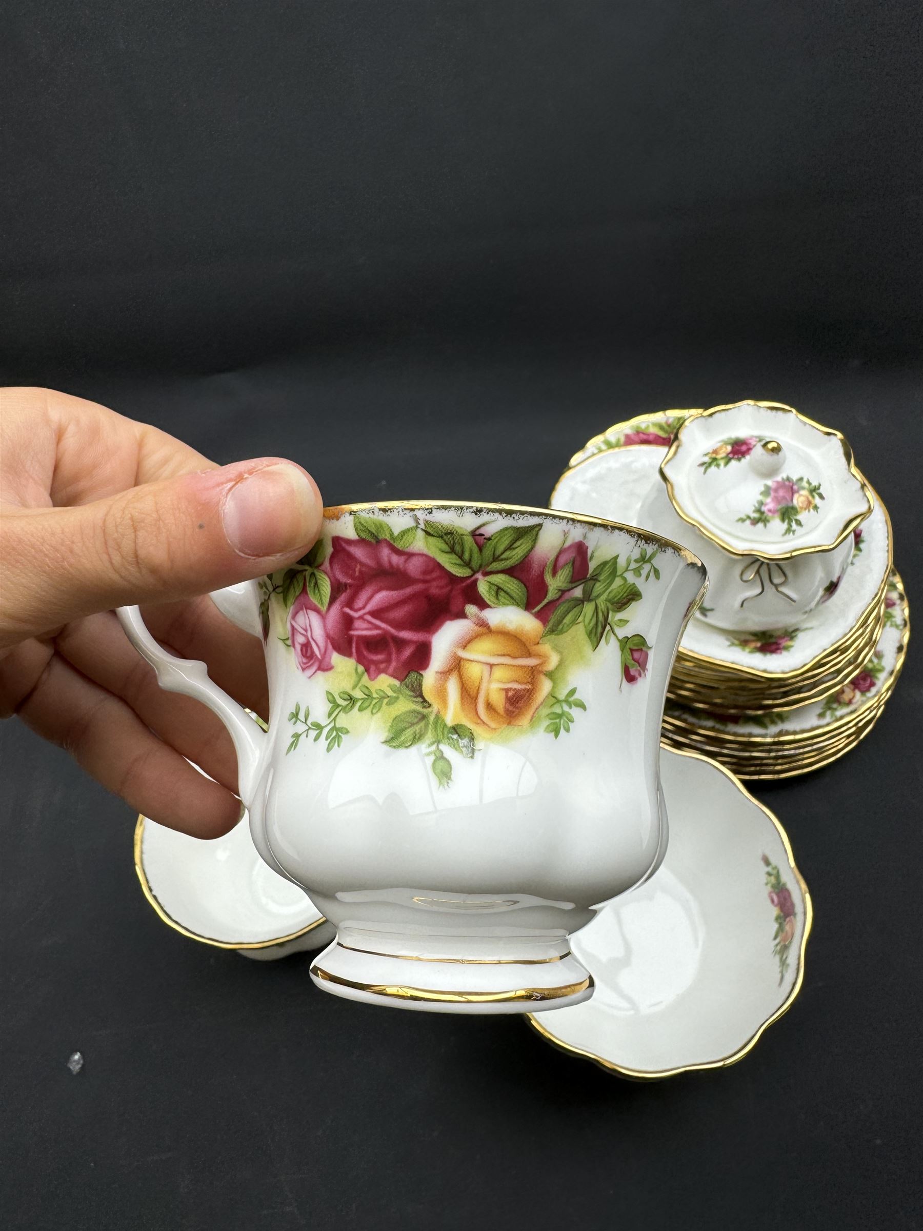 Royal Albert Old Country Roses tea service for six, comprising teapot, milk jug, open sucrier, cups and saucers, dessert plates, two trinket dishes covered jar and clock