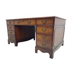 Georgian design mahogany twin pedestal desk, the moulded rectangular top inset with leather writing surface, fitted with eight drawers (W152cm, D91cm, H76cm); and a matching two-drawer filing cabinet (W54cm, H76cm, D71cm)
