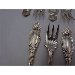 Set of twelve American silver oyster/pickle forks, three pronged forks, the stem decorated with ribbon banding and foliate border surrounding an engraved initial, stamped Sterling 