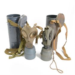 Two 1930's French defence passive gas masks, in metal canisters