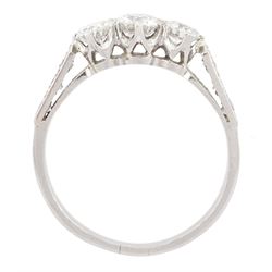 Early 20th century platinum three stone old cut diamond ring, with diamond set shoulders, total diamond weight approx 1.20 carat