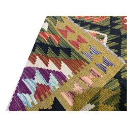 Chobi kilim multi-coloured rug, the field decorated with various lozenges with dark indigo borders, enclosed by a guard band with repeating broken-lozenge design