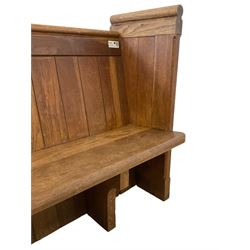 19th century oak church pew or hall bench, moulded cresting rail over panelled back and plank seat, on panelled end supports with chamfered frames