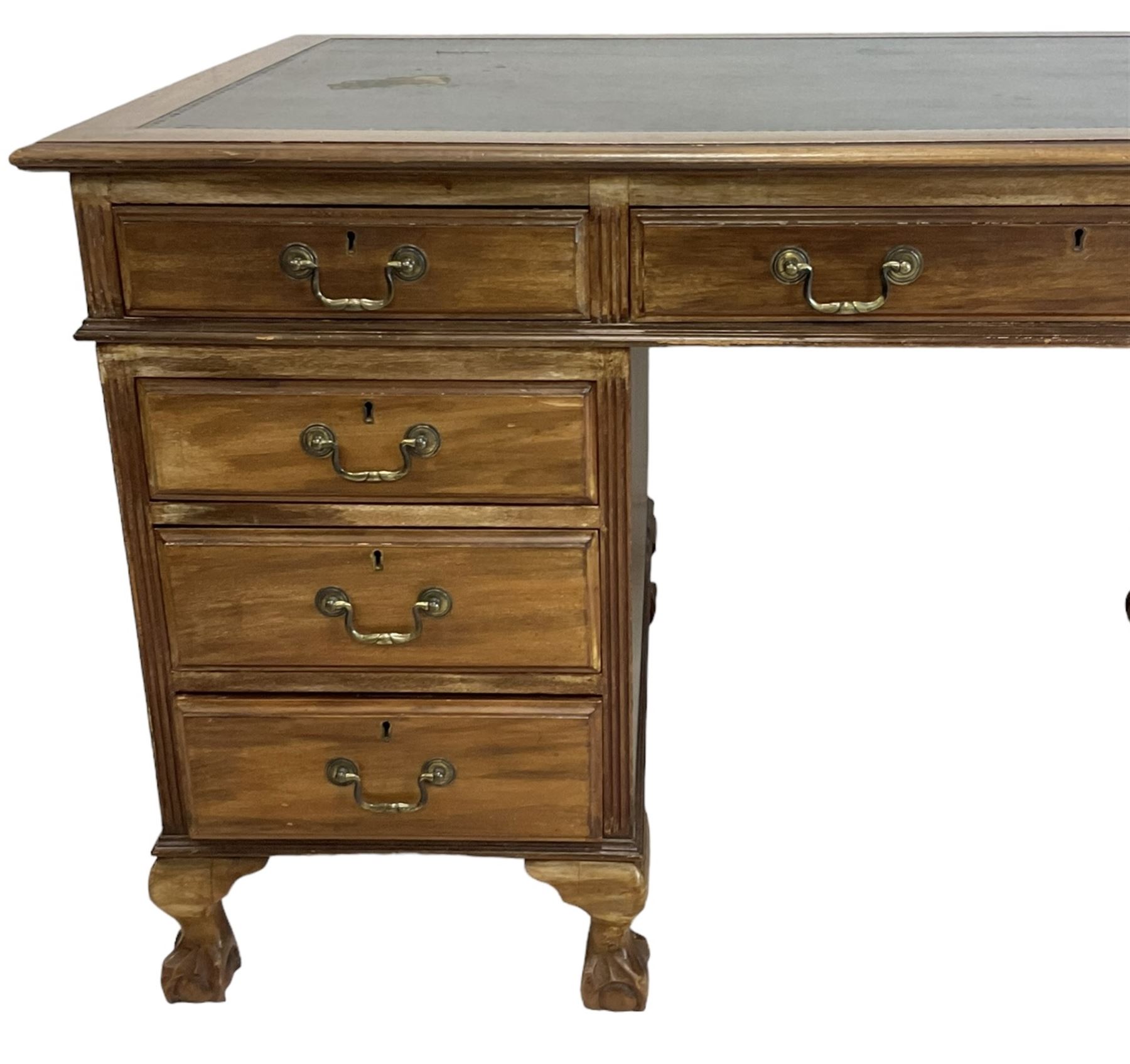 Georgian design twin pedestal desk, rectangular top with green leather inset, fitted with nine drawers, on cabriole supports with ball and claw feet 